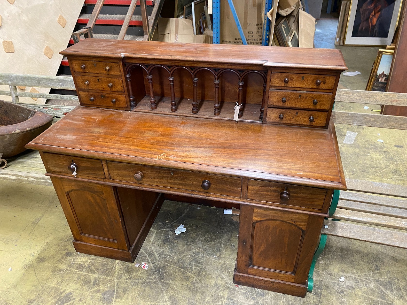 A Victorian style mahogany kneehole desk, length 140cm, depth 64cm, height 110cm